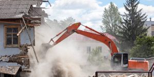 Residential Demolition by an excavator 