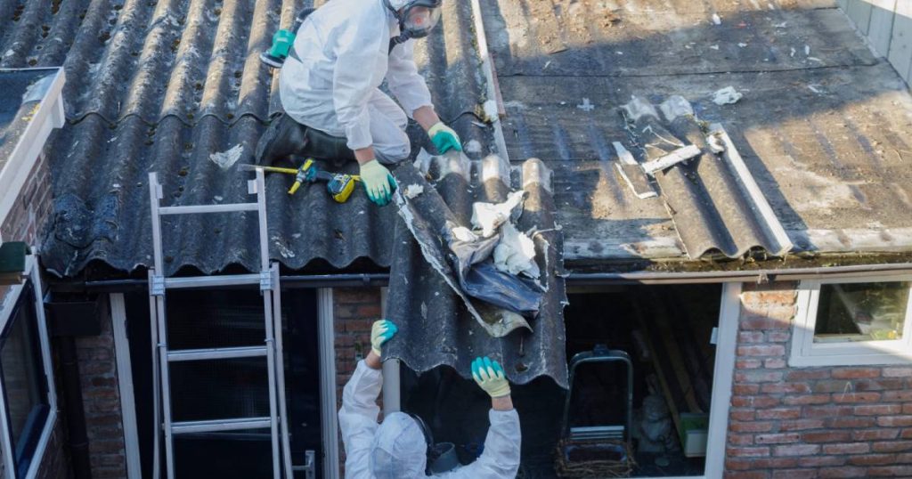 People clearing asbestos house