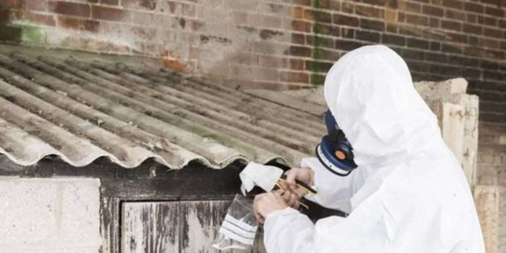 Experienced asbestos roof removal professionals working diligently to safely eliminate asbestos from roofs.