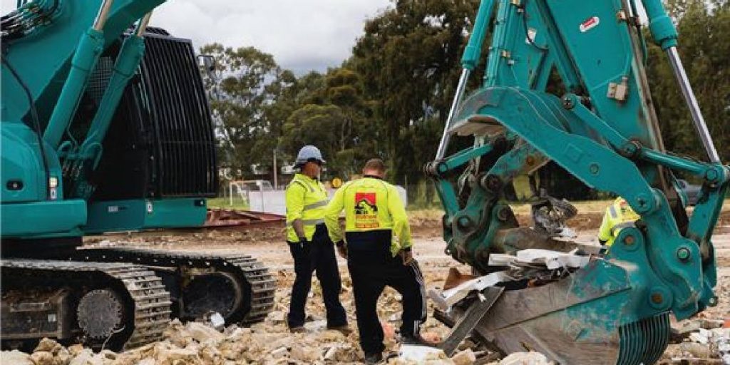 Two experienced demolition contractors discussing a project for Kiama Demolition Company.