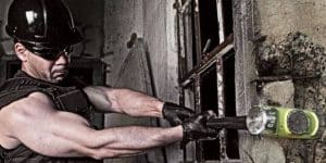 Demolition expert utilizing advanced demolition tools to dismantle structure safely and efficiently.